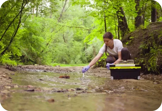 Conservation_Woman scientist environmentalist sitting near the creek_1_conservation_and_land_management_aag_disease_certificate_iii_in_and_ecosystem_land_courses_ahc31421